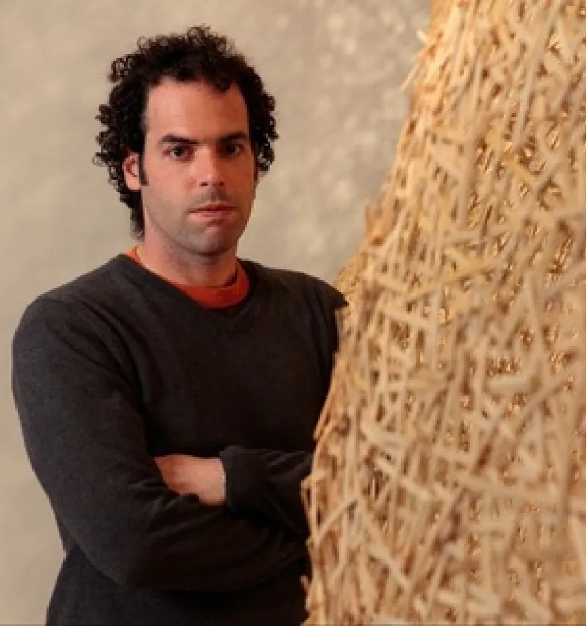 Modern artist Jonathan Brilliant with a textured sculpture, highlighting craftsmanship and creative design